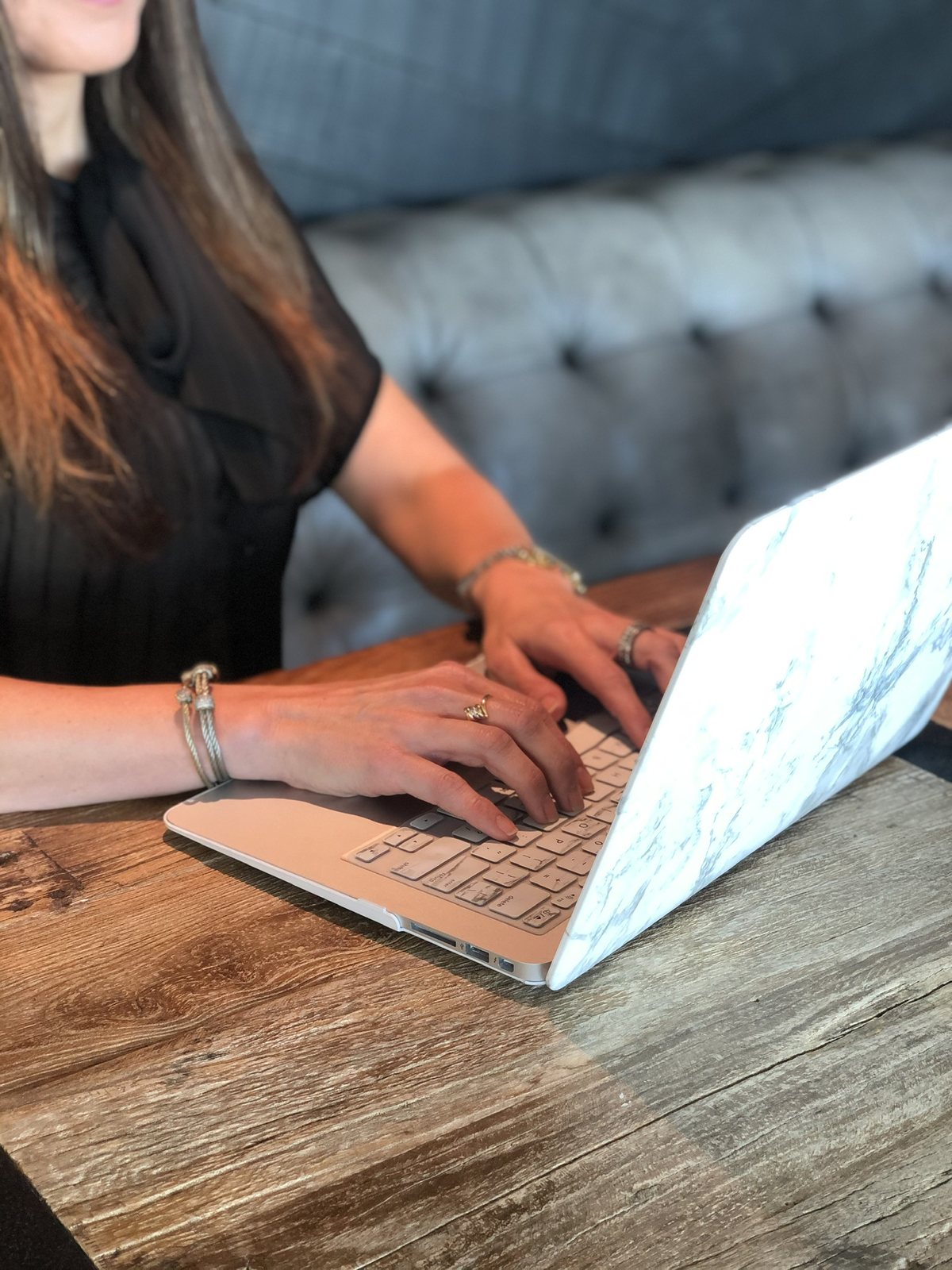 Kelly Goble preparing session materials at a laptop
